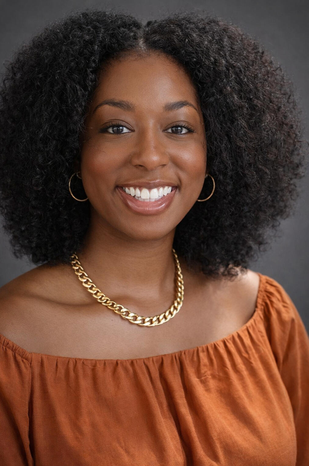 image of the black woman business owner smiling